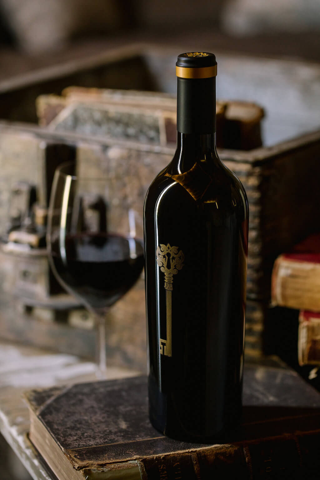 Voir Dire Wine Bottle Next to a Poured Glass of Wine